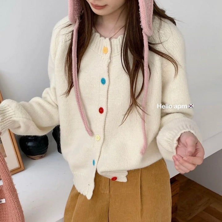 Gilet en tricot ludique pour femme avec détails de boutons colorés et coupe décontractée Chic & Stil
