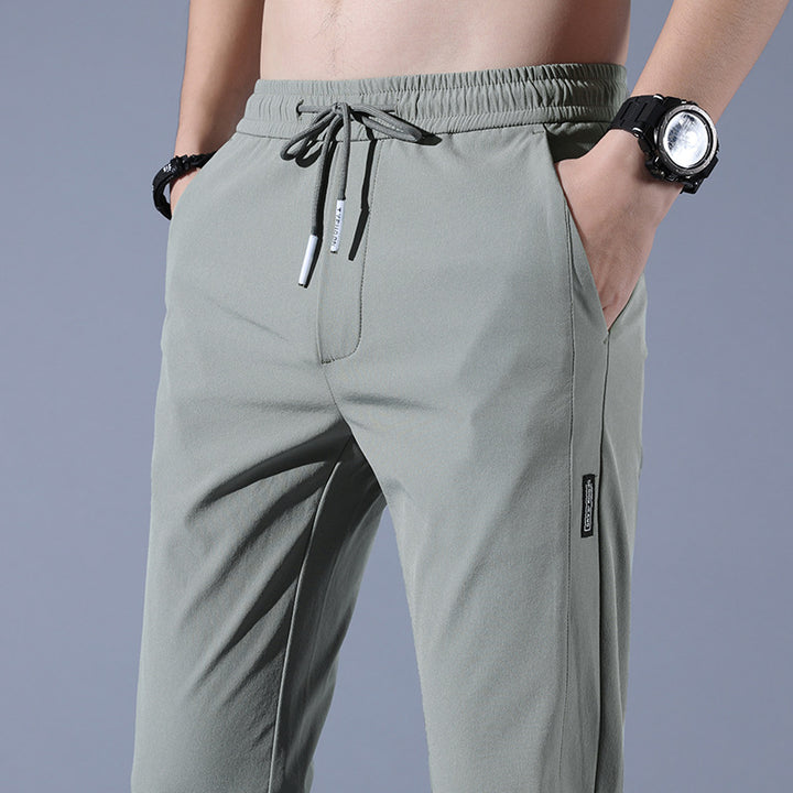 Sports jogger pants for men with elastic waist and practical zip pockets Lune London