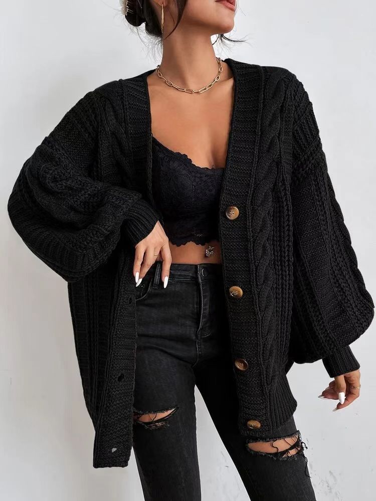 Oversized knitted cardigan for women with an elegant cable pattern and practical buttons Lune London
