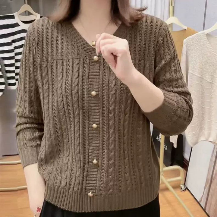 Women's knitted jacket with a delicate braid pattern and elegant pearl buttons Lune London
