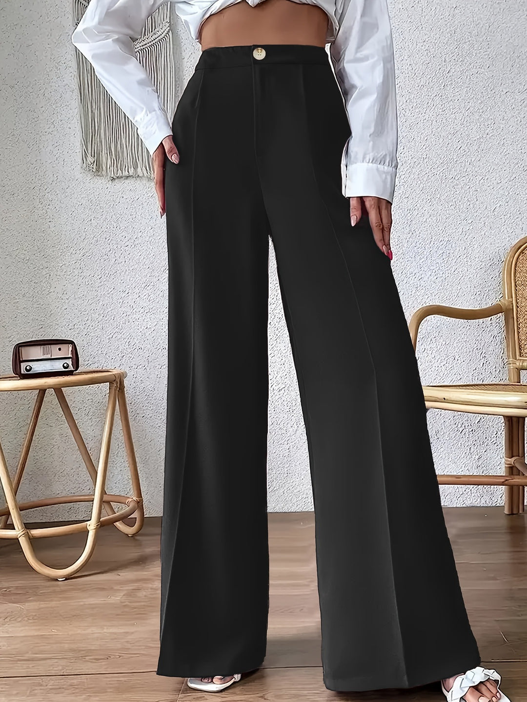 Wide palazzo pants for women with a stylish high waist cut and a button detail Lune London