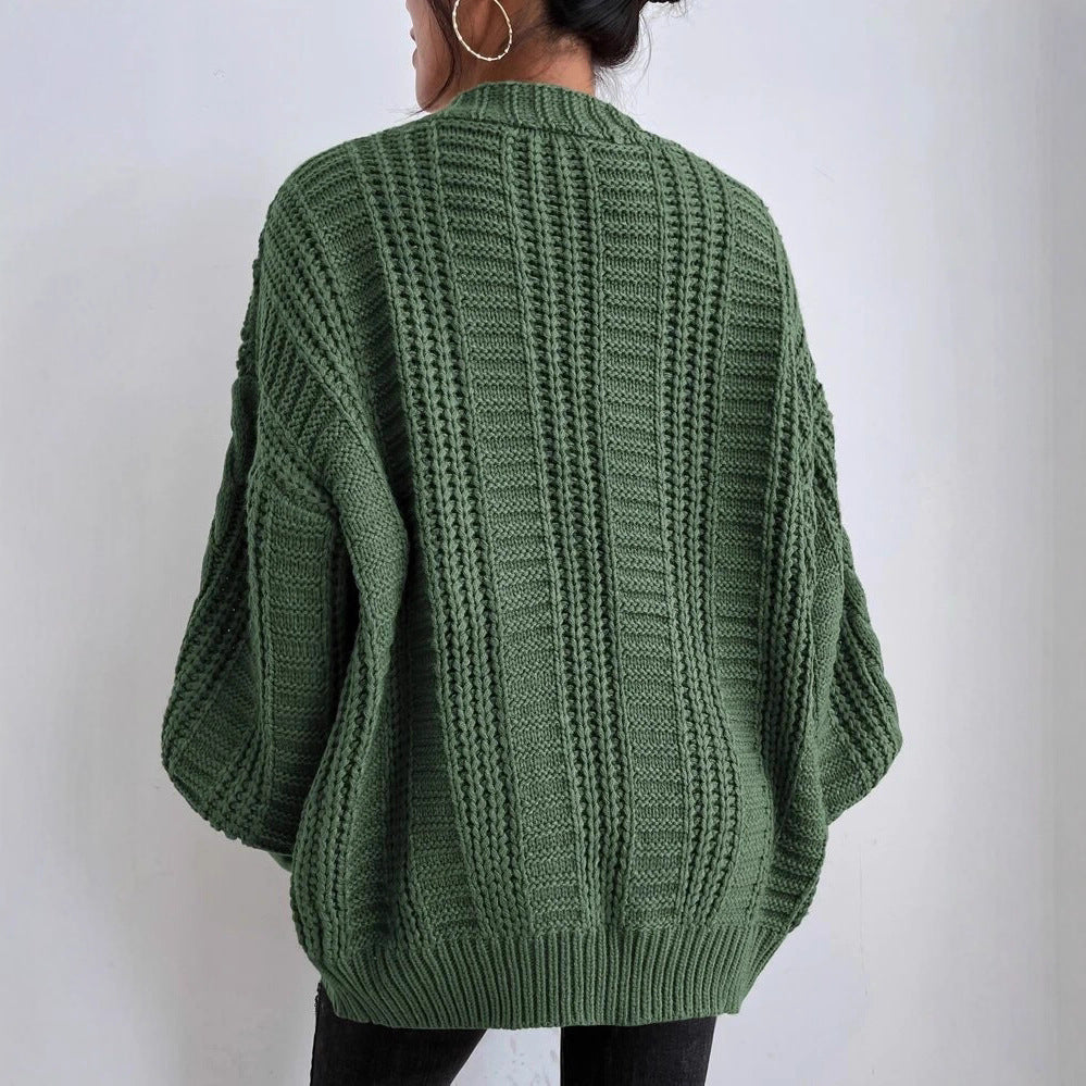 Oversized knitted cardigan for women with an elegant cable pattern and practical buttons Lune London