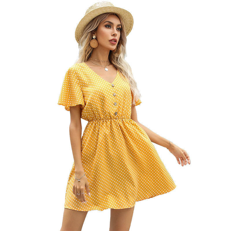 Robe à pois pour femmes avec taille élastique et détails de boutons élégants Chic & Stil