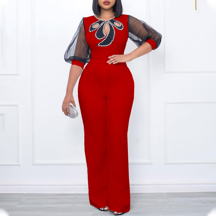 Elegant woman’s jumpsuit with sheer sleeves and pearl embellishment Lune London