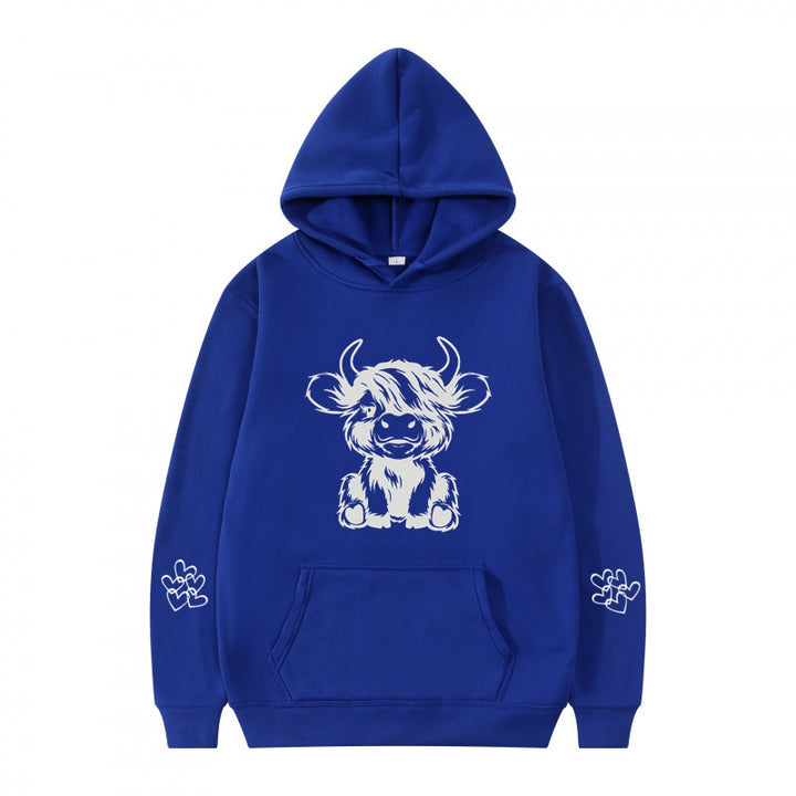 Women's hooded sweatshirt with charming cow motif and practical kangaroo pockets Lune London