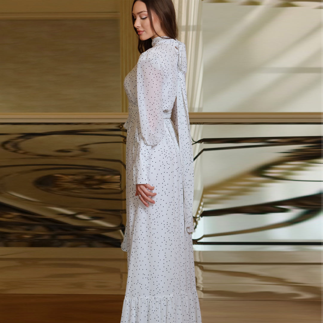 Women's maxi dress with elegant polka dots and sophisticated ruffle details