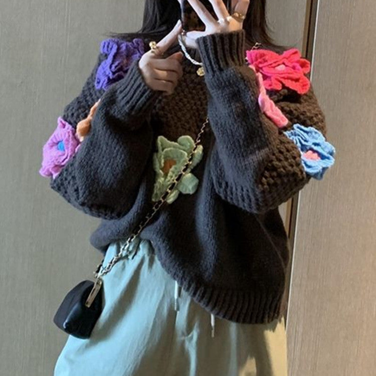 Women’s knitted sweater with chic floral appliqués and style