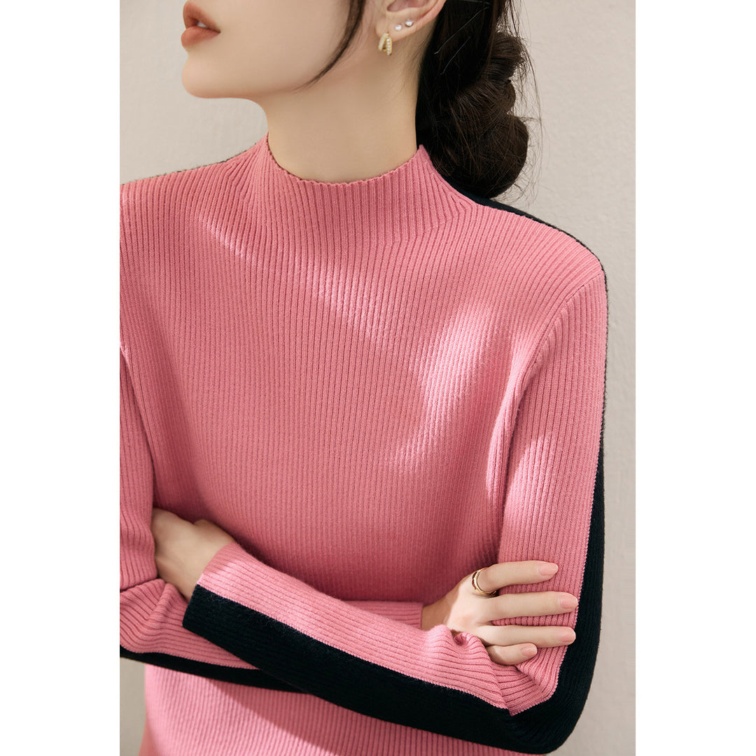 Pull à col roulé tendance pour femmes avec design en côtes texturées et manches contrastantes Chic & Stil
