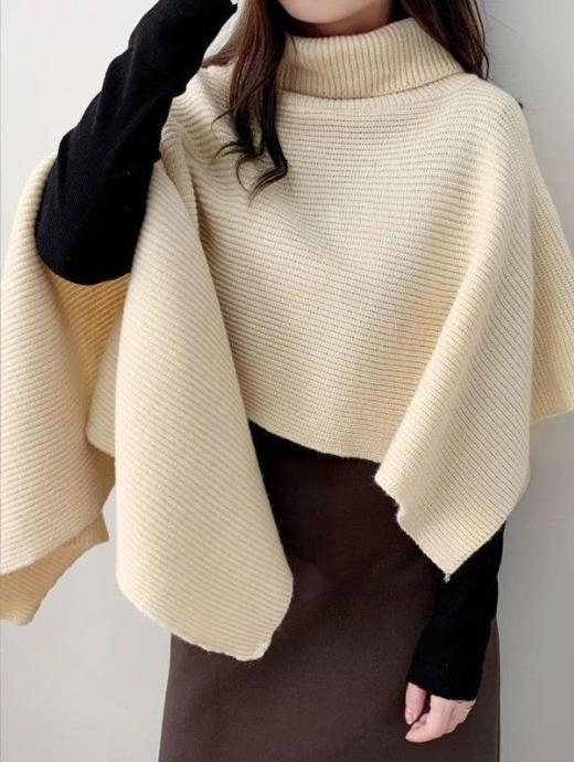 Ladies knitted poncho with high collar and asymmetrical cut Lune London