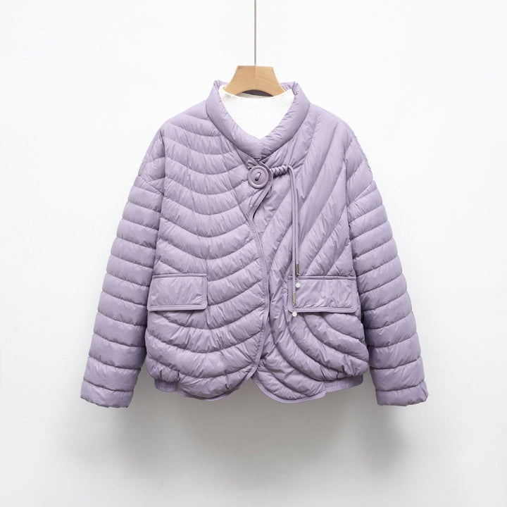 Trendy quilted jacket for women with asymmetrical cut and practical pockets Lune London