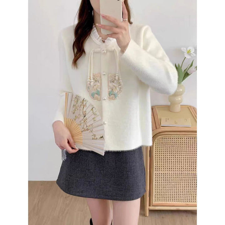 Luxurious knit sweater for women with decorative button details and ruffles Lune London
