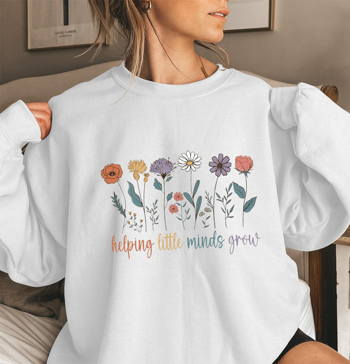 Sweat-shirt femme avec des manches volumineuses et un imprimé floral motivant Chic & Stil