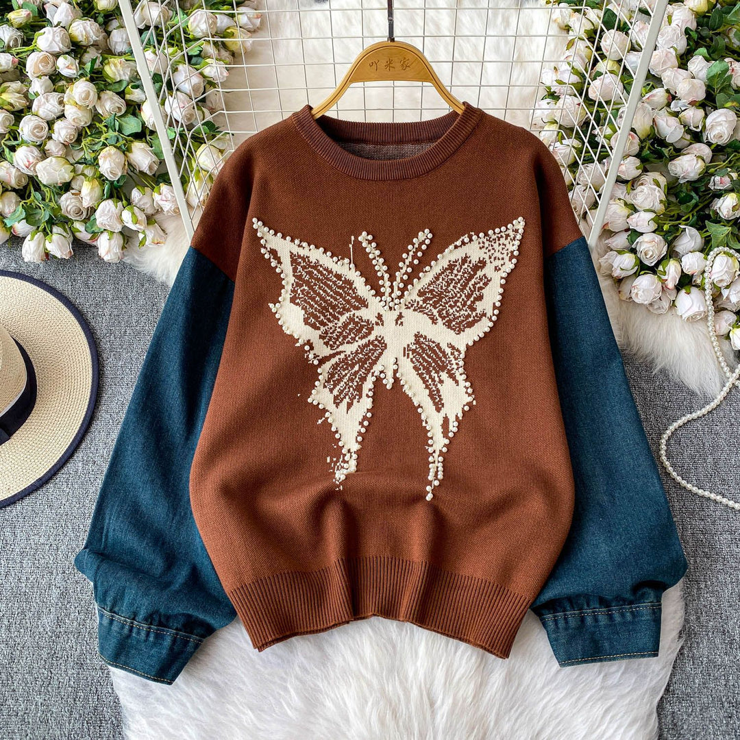 Pull élégant pour femmes avec motif de papillon et manches en denim Chic & Stil