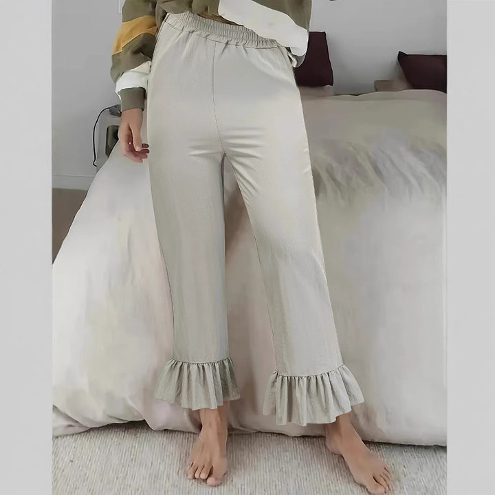 Women's flared pants with playful ruffle details Lune London