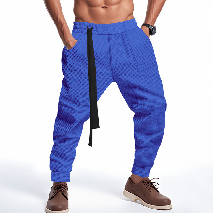 Casual men's jogging pants in textured fabric with elastic waist and drawstring Lune London