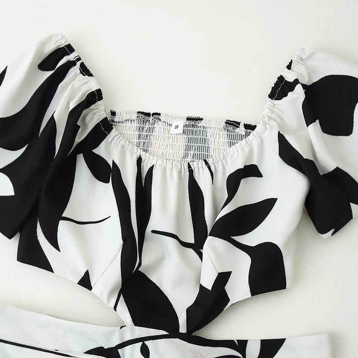 Maxi dress for women with floral cutout and ruffle details Lune London