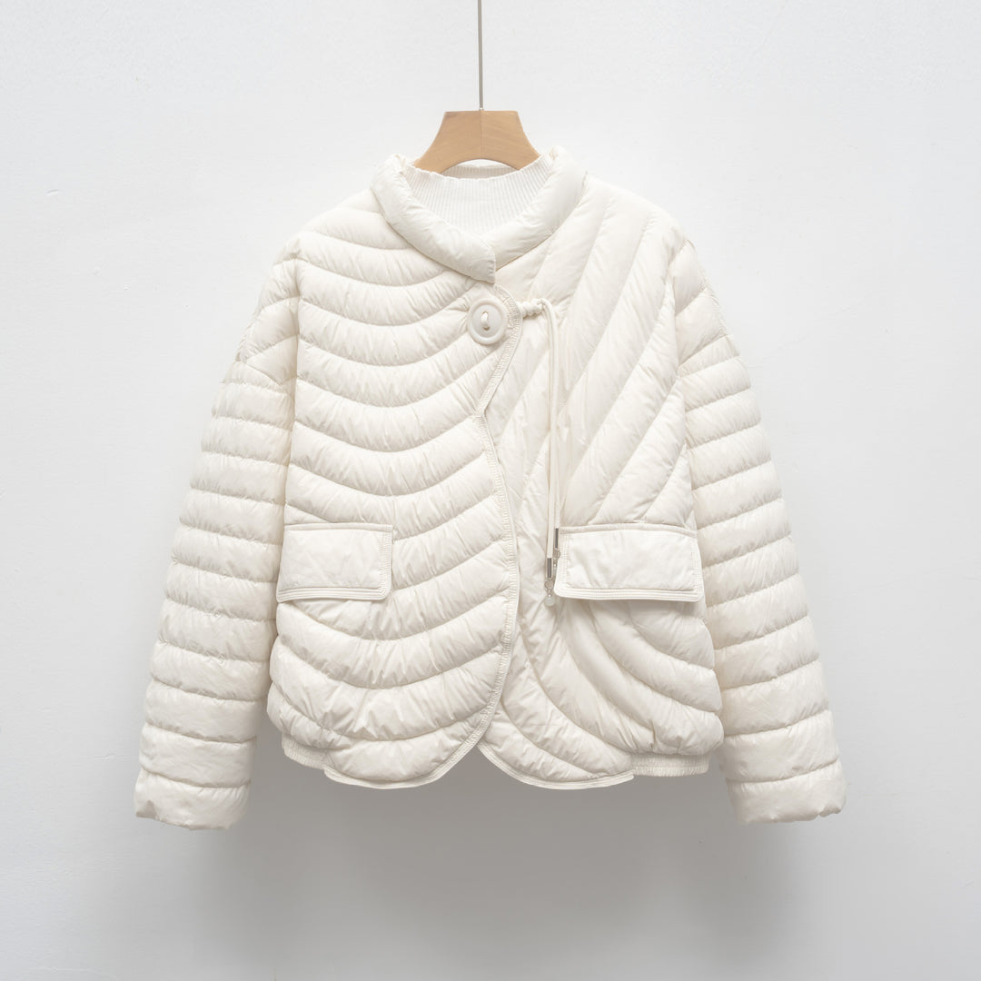 Trendy quilted jacket for women with asymmetrical cut and practical pockets Lune London