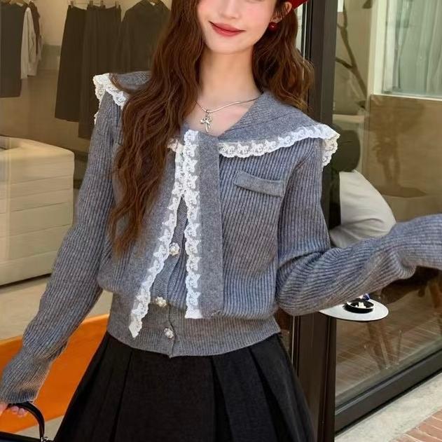 Knitted jacket for women with ruffled collar and decorative buttons Lune London