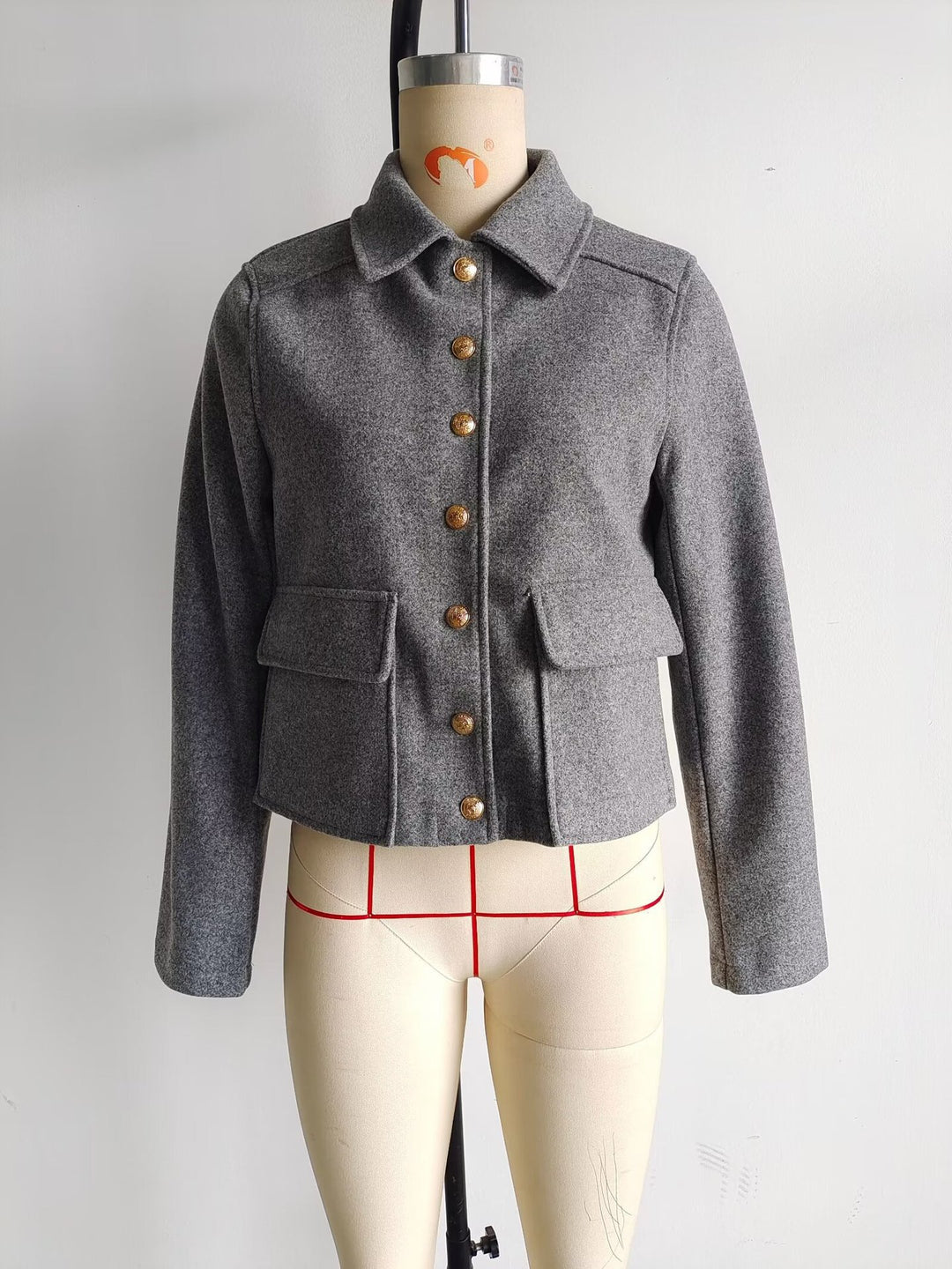 Short trendy jacket for ladies with practical pockets and gold buttons Lune London