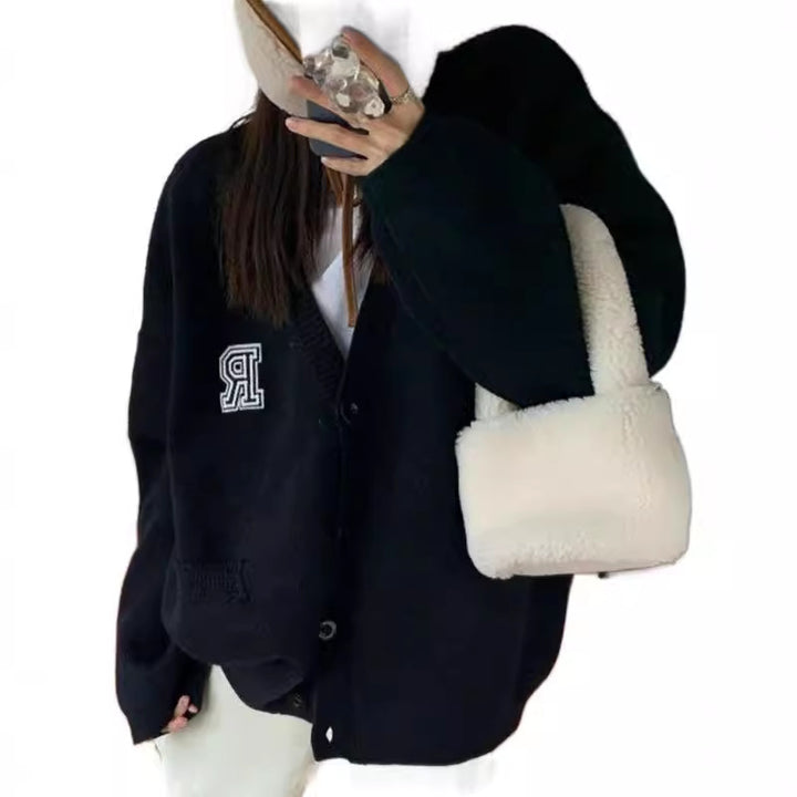 Casual knitted jacket for women with front pockets and button closure Lune London