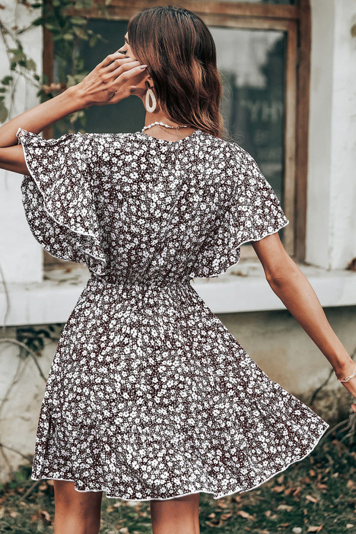 Ladies Twirl Dress with Flowing Floral Sleeves Lune London