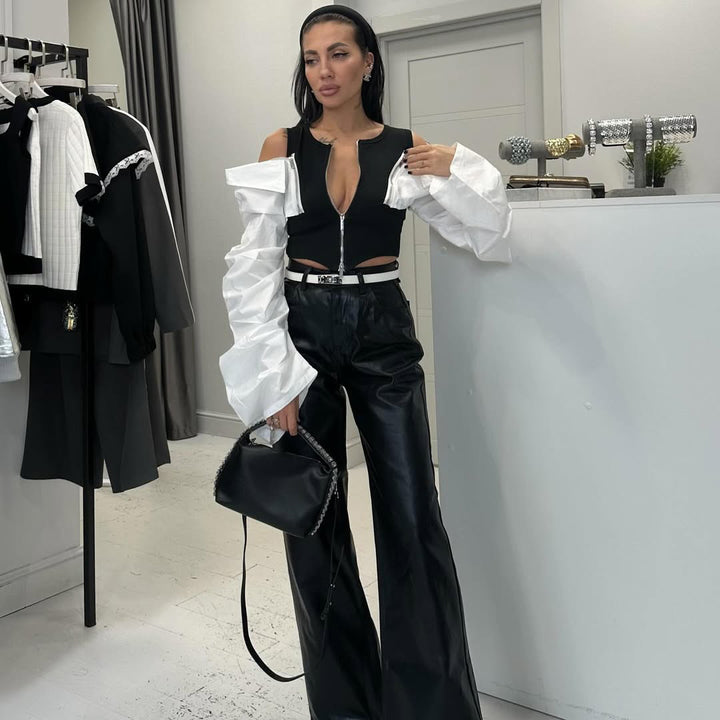 Ladies High fashion with striking puffed sleeves and a chic zipper closure