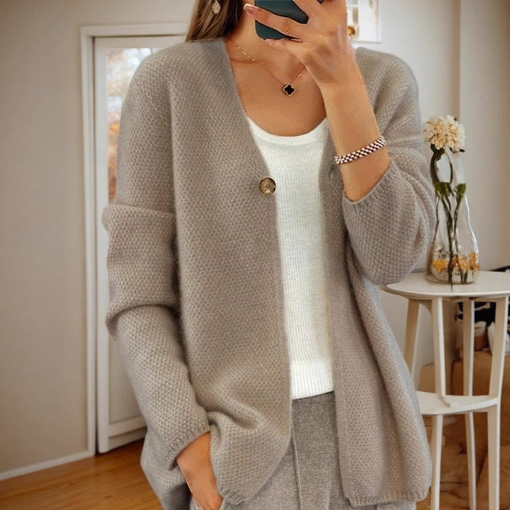 Women's knitted jacket with a fine textured pattern and a button detail Lune London