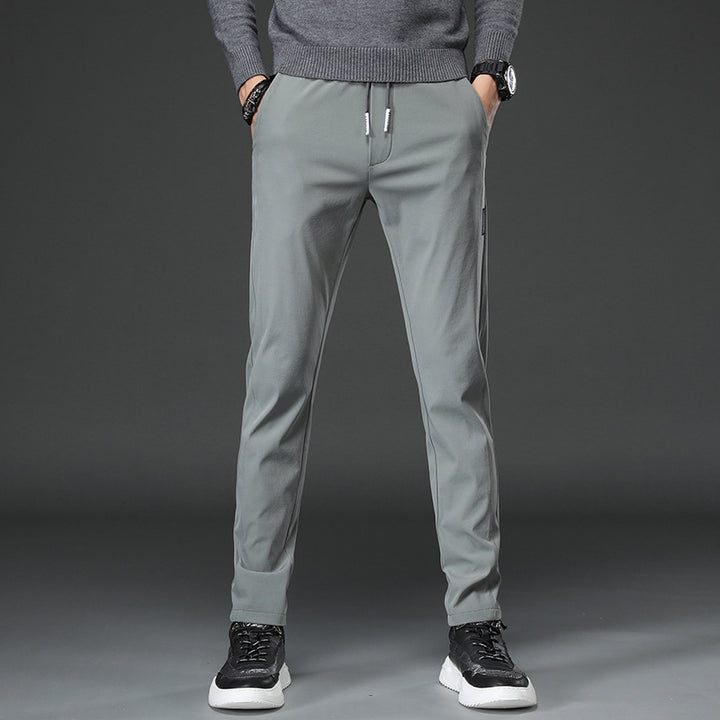 Men's slim fit sports pants with elastic waistband and practical zip pockets Lune London