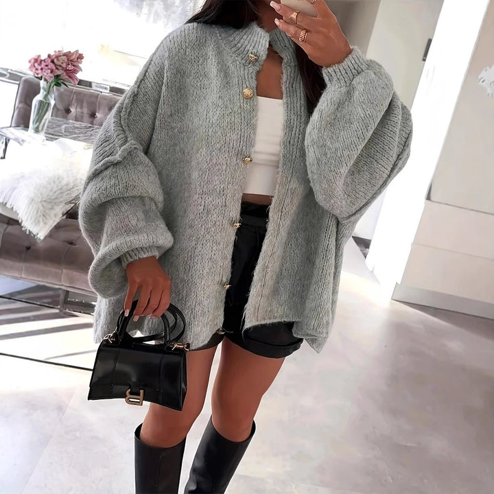 Oversized knit jacket for women with elegant puff sleeves and a chic button placket