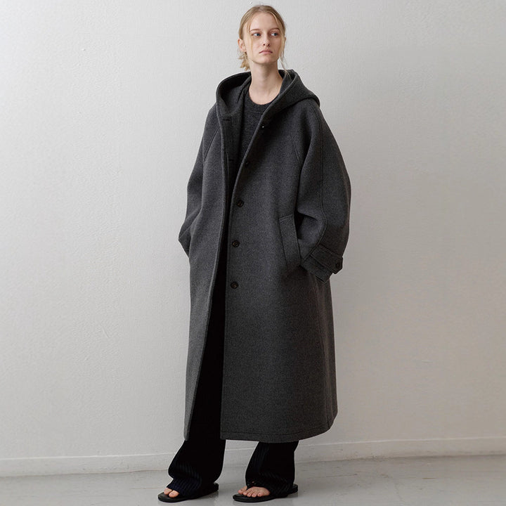 Manteau surdimensionné élégant pour femmes avec capuche et poches pratiques Chic & Stil