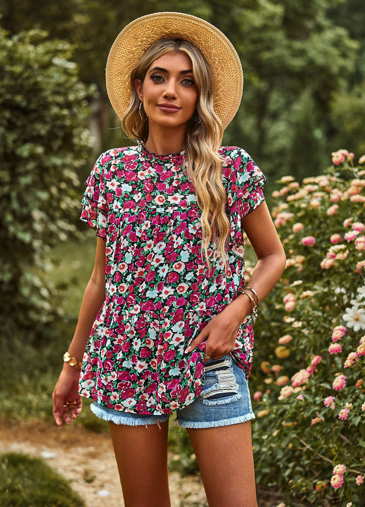 Dynamic women's blouse with ruffled details and floral design Lune London