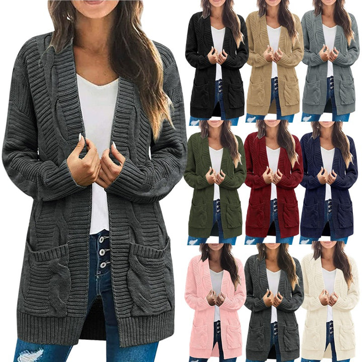 Ladies chunky knit cardigan with elegant cable patterns and practical pockets Lune London
