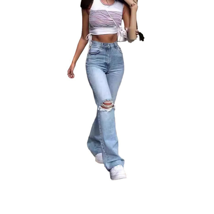 Ladies vintage flared jeans with stylish ripped details and high waistband Lune London
