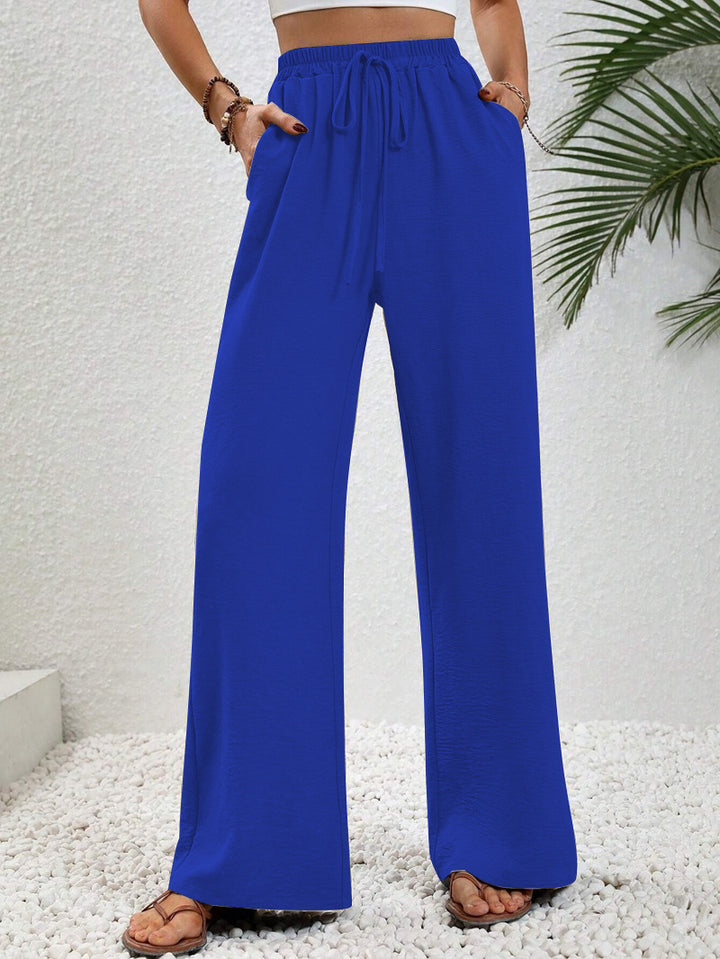 Pantalons larges d'été pour femmes avec taille élastique et poches latérales pratiques Chic & Stil