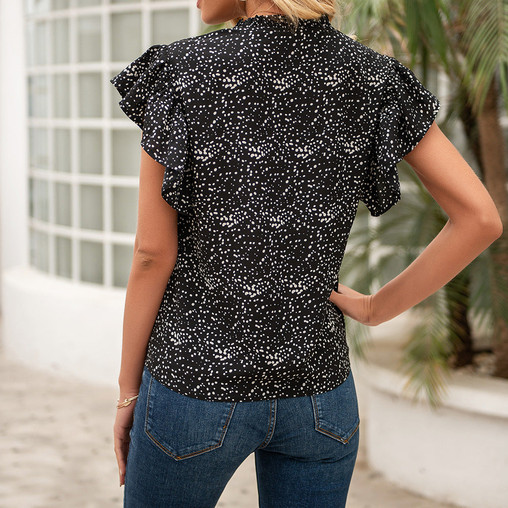 Women's blouse with ruffled sleeves and a woven polka dot pattern Lune London