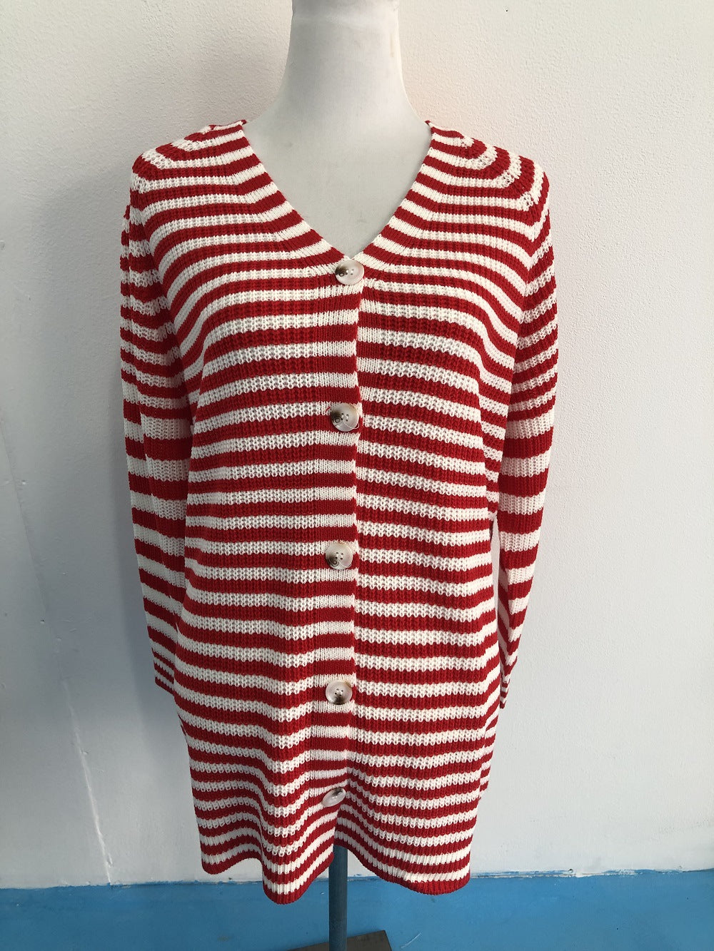Ladies long sleeve knit cardigan with a modern striped pattern and buttons Lune London