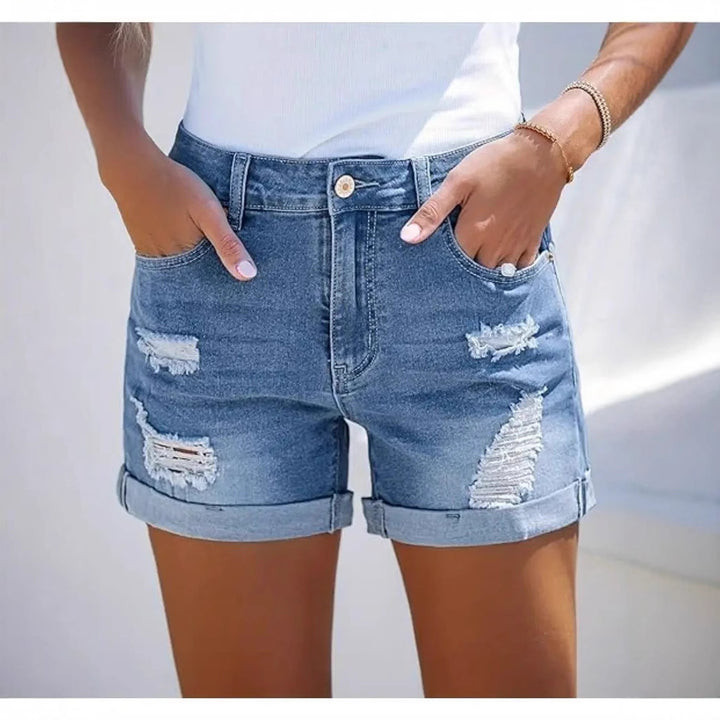 Women's short destroyed denim shorts in a casual look with rolled hems and stylish ripped details Lune London