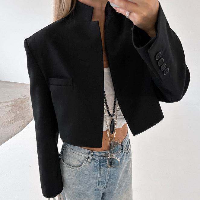 Short fitted jacket for ladies with a modern look featuring a high collar and elegant button details Lune London