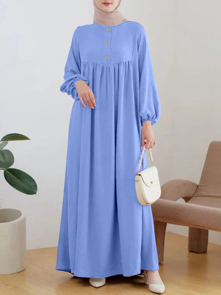 Lightweight maxi dress for women with comfortable buttoning and elegant puff sleeves Lune London