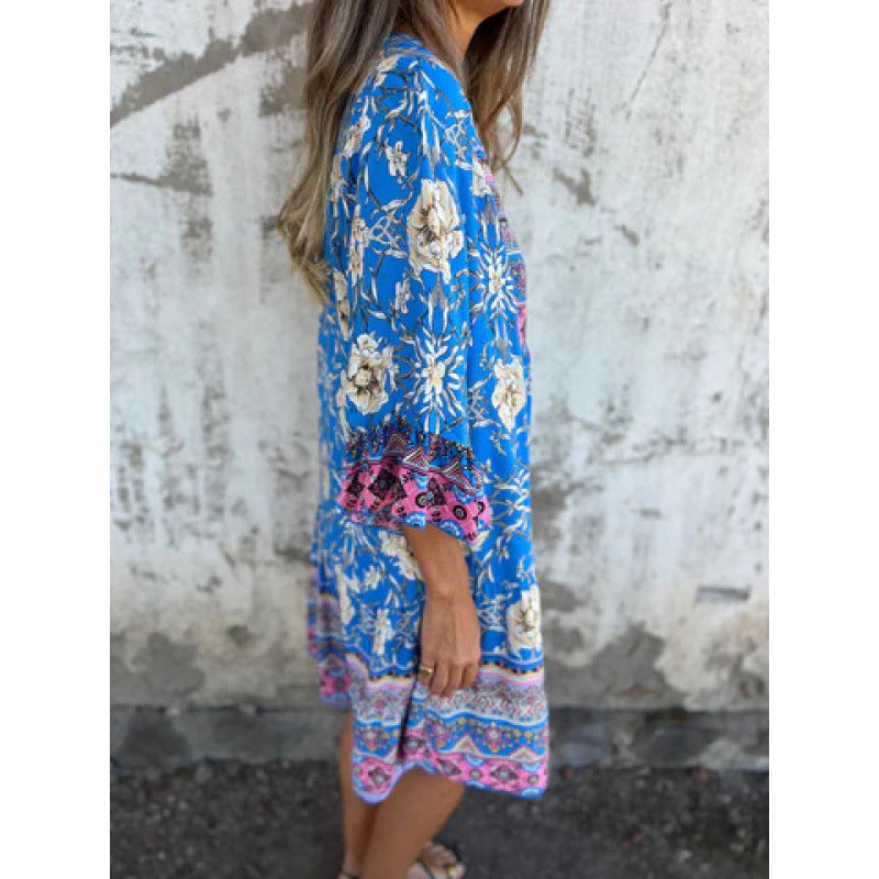 Casual blouse dress for women with a colorful floral pattern and a flared knee hem Lune London
