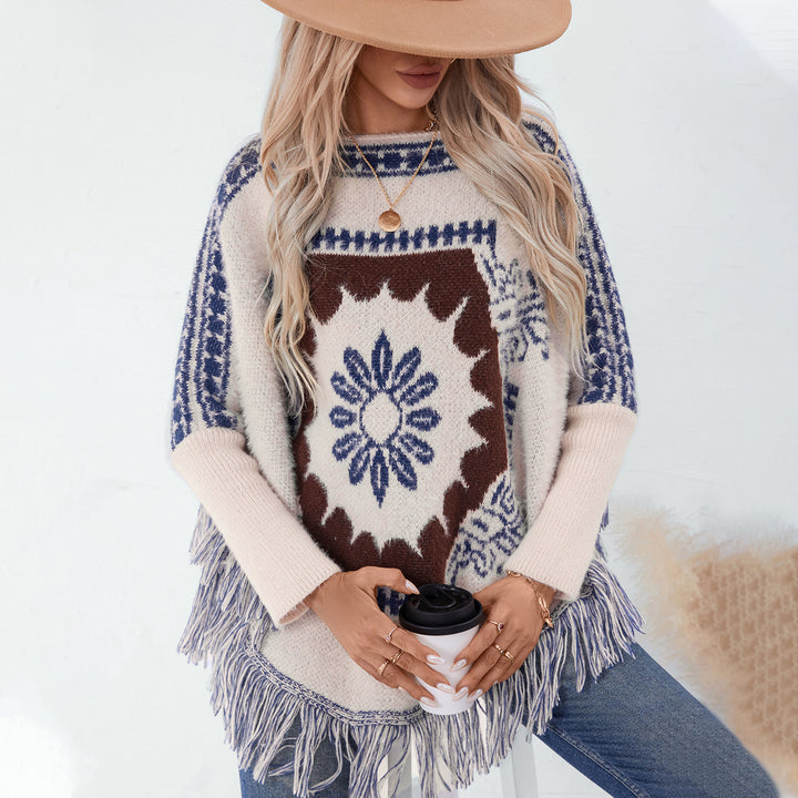 Ladies elegant knitted poncho with artistic pattern and fringe finish Lune London