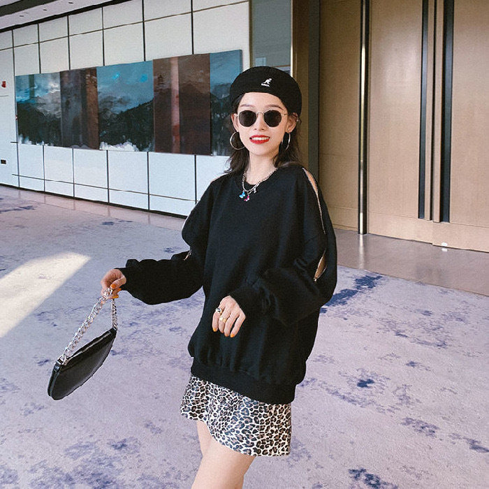 Women's casual oversized pullover with open shoulders and modern design