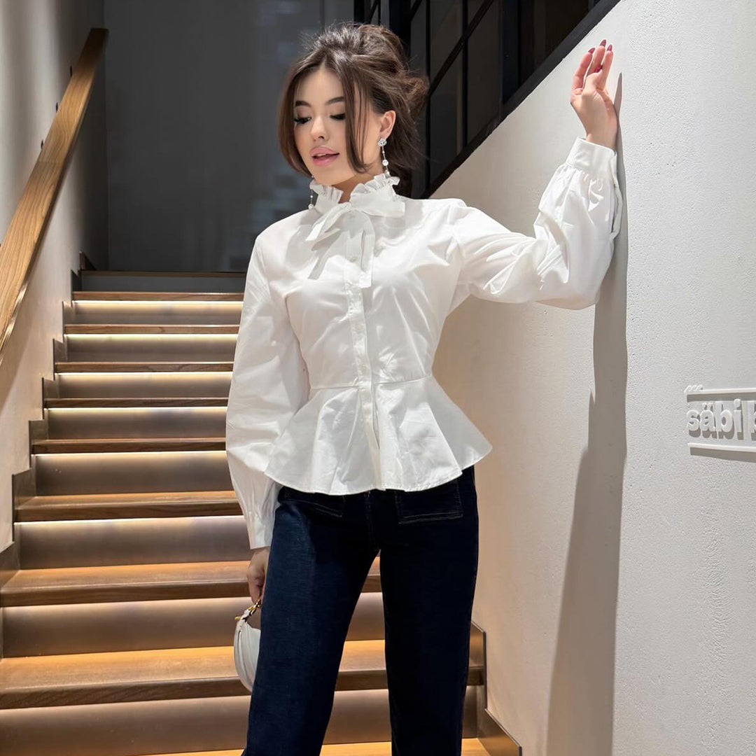 Ladies blouse with ruffle detail and flattering cut