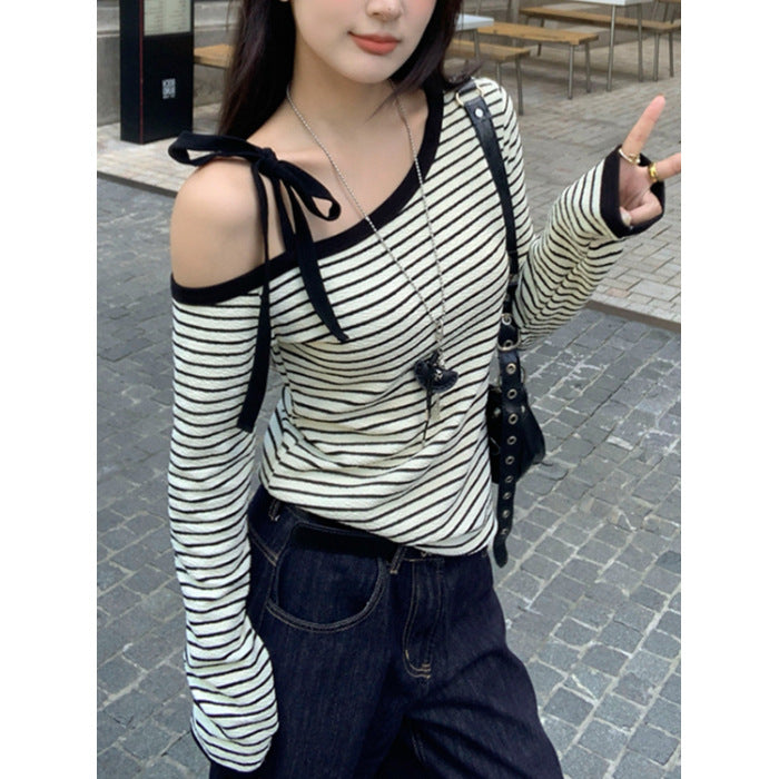 Women's off-shoulder long-sleeve shirt with striped design and decorative bow details Chic & Stil