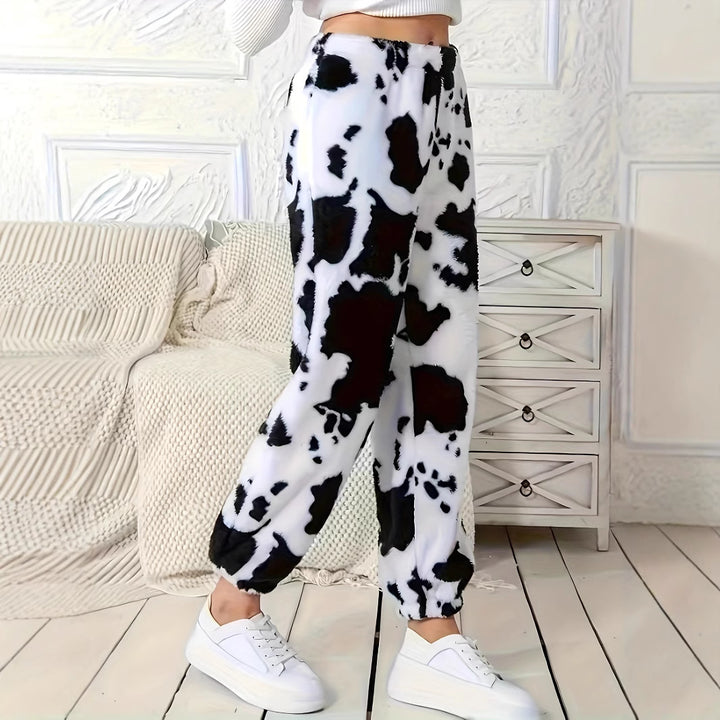 Ladies plush pants with a trendy cow spot pattern and elastic waist Lune London