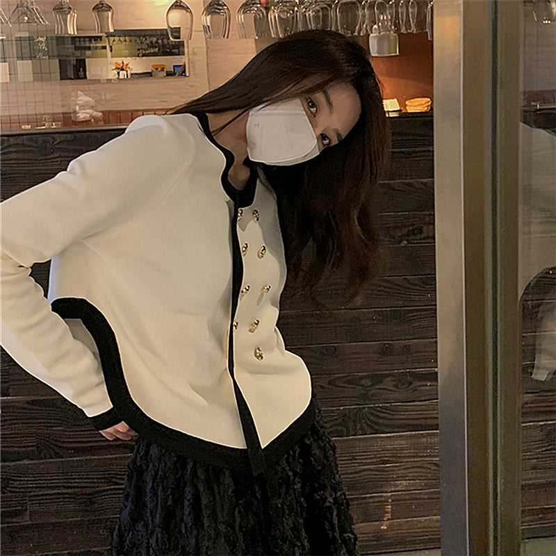 Elegant ladies cardigan with gold button details and contrasting finishes Lune London