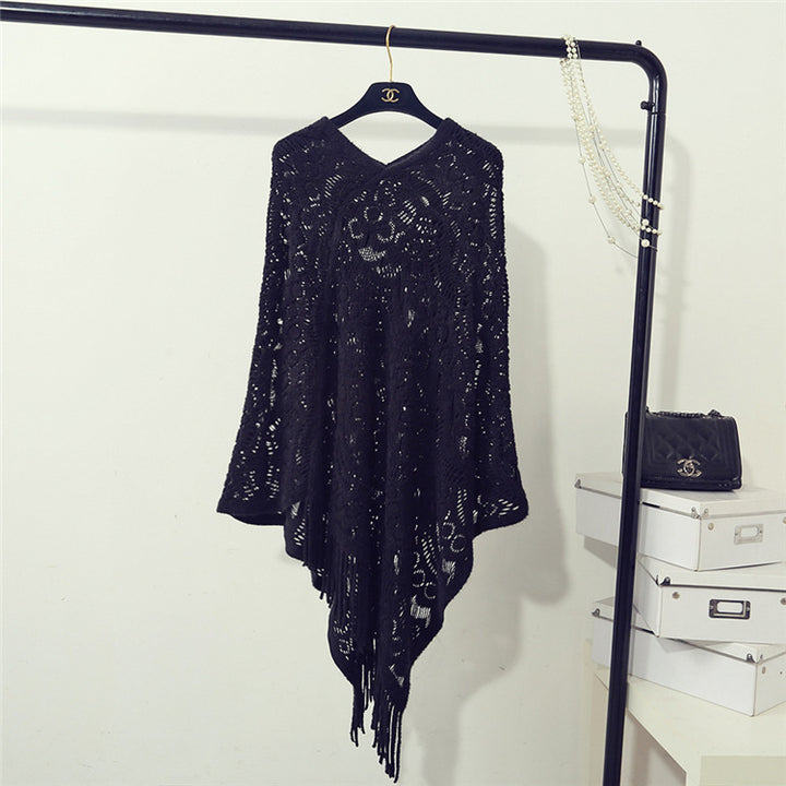 Knit poncho for women with an eye-catching crochet pattern and fashionable fringes Lune London