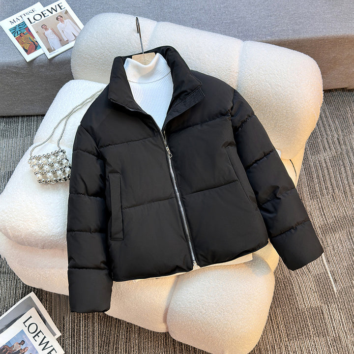 Short quilted jacket for women with high collar and practical piped pockets Lune London