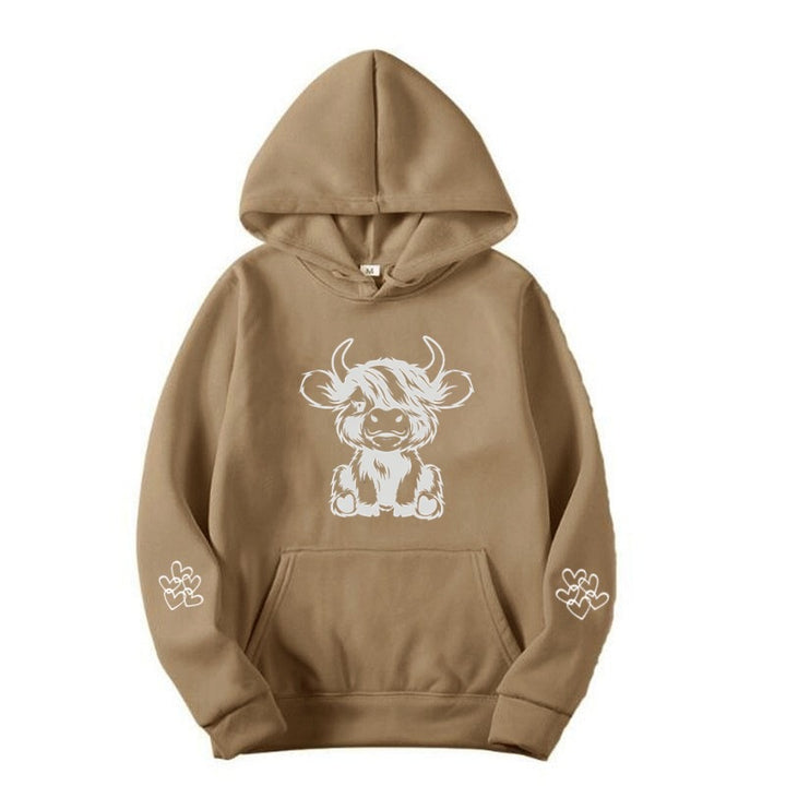 Women's hooded sweatshirt with charming cow motif and practical kangaroo pockets Lune London