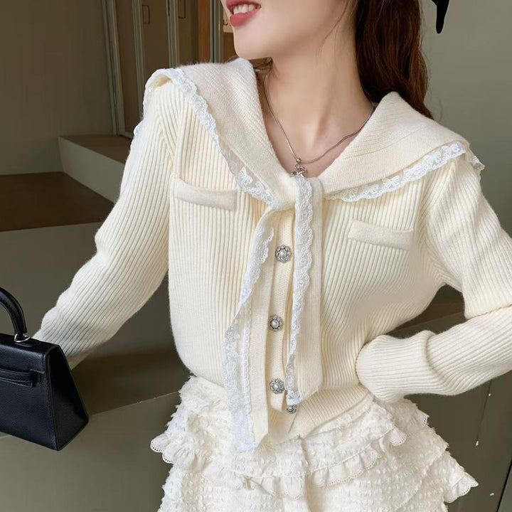 Knitted jacket for women with ruffled collar and decorative buttons Lune London